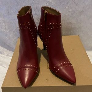 women red and gold studded leather like botties